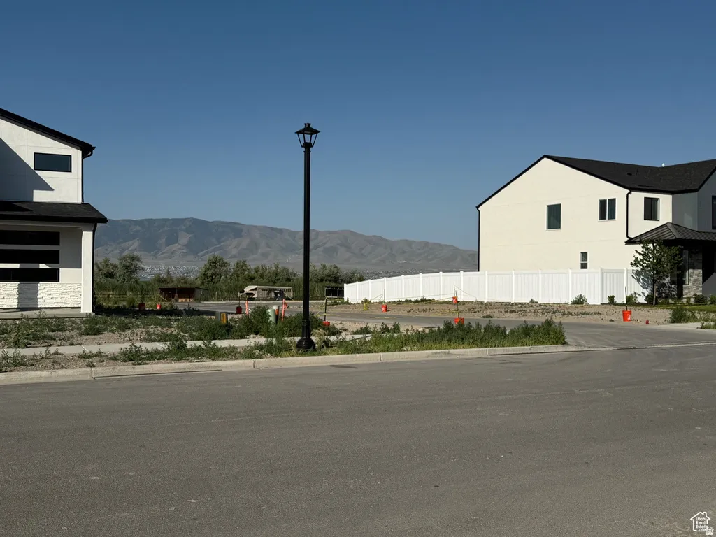 New construction homes featuring contemporary black framed windows and dark shingled roofs