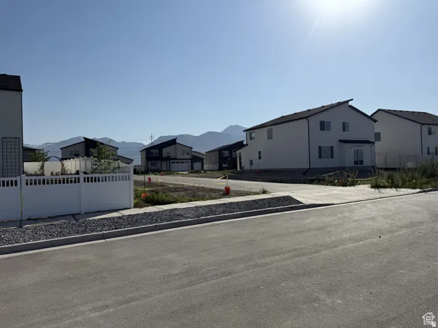 Newly constructed residential street with concrete sidewalks and a gravel shoulder
