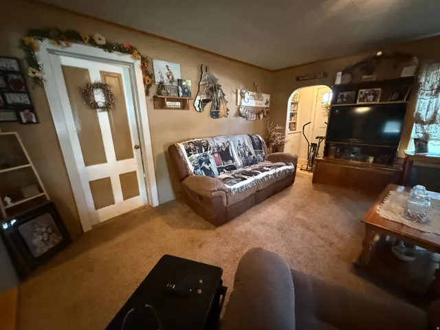 Wall-to-wall carpeting and neutral wall tones create a cohesive interior space