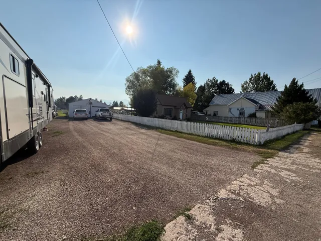 Expansive gravel driveway providing ample off-street parking