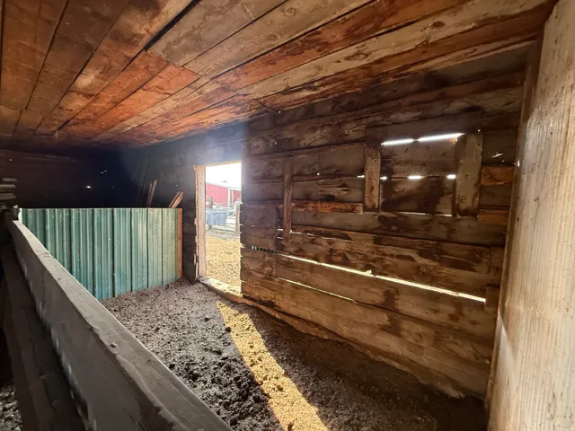 Interior structure with exposed wood plank walls and ceiling