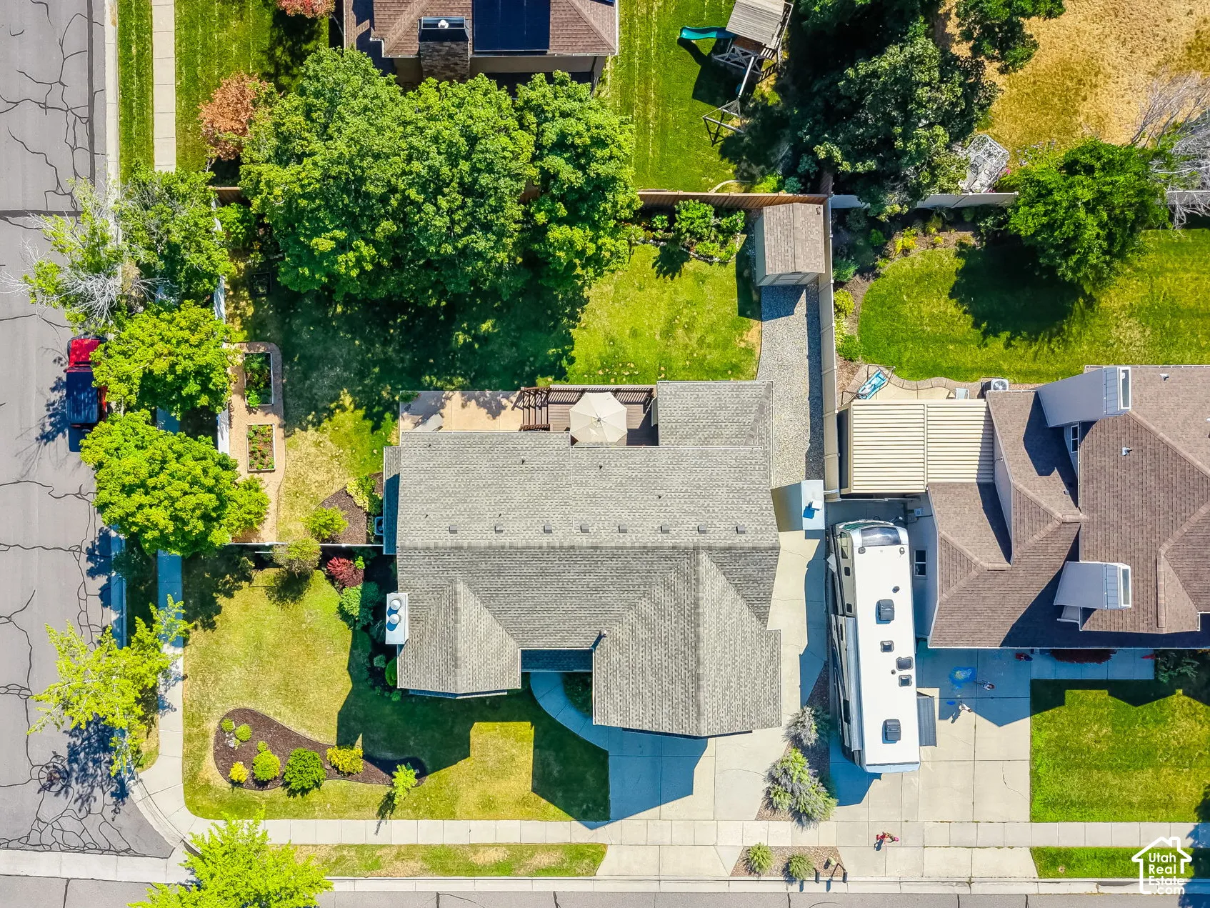 Aerial perspective showcasing a residential property with a spacious backyard