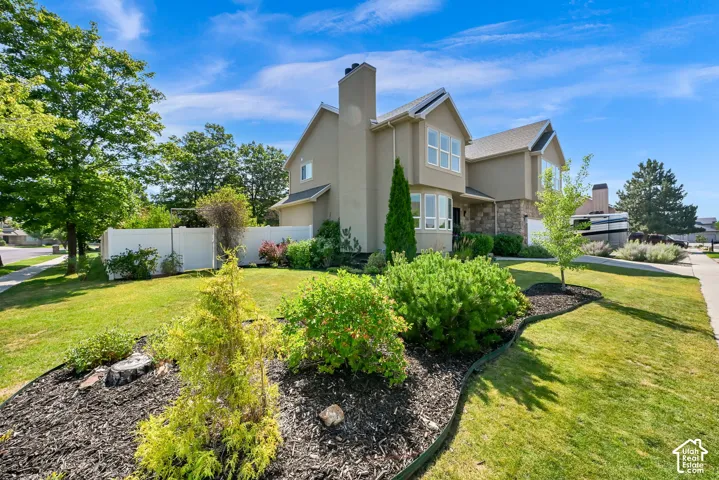 Side view of property showing flower bed.