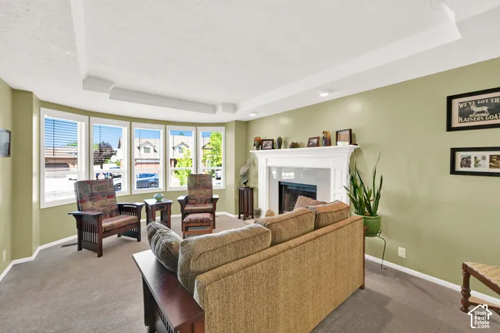 Bright and airy living room bathed in natural light from expansive multi-pane windows