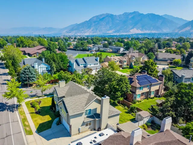Aerial perspective showcasing a residential area with varied home styles and mature landscaping
