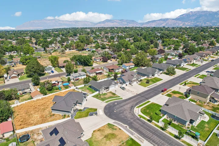 Aerial perspective of a residential neighborhood with mountain scenery