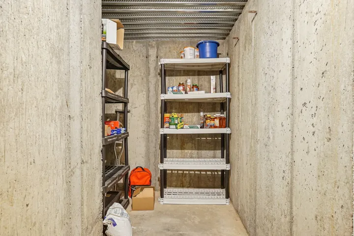 Concrete walls featuring exposed corrugated metal ceiling