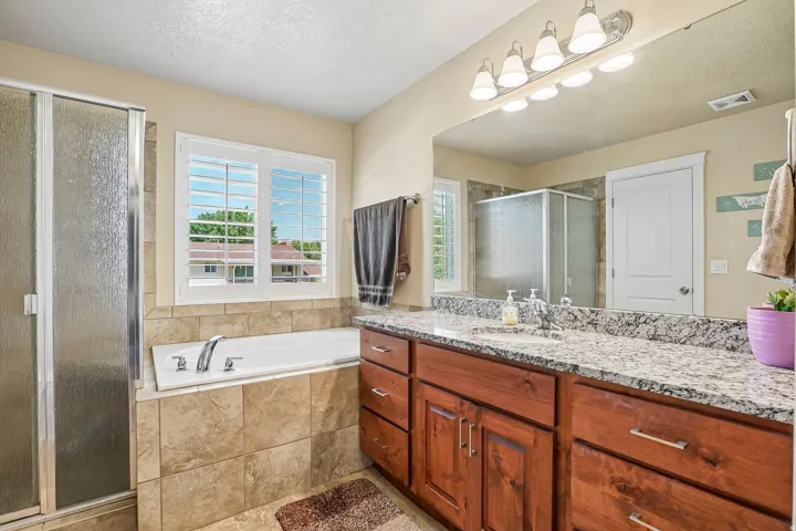 Double vanity with granite countertop and undermount sink