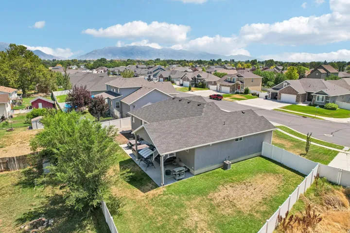 Aerial perspective showcasing a residential neighborhood with distant mountains