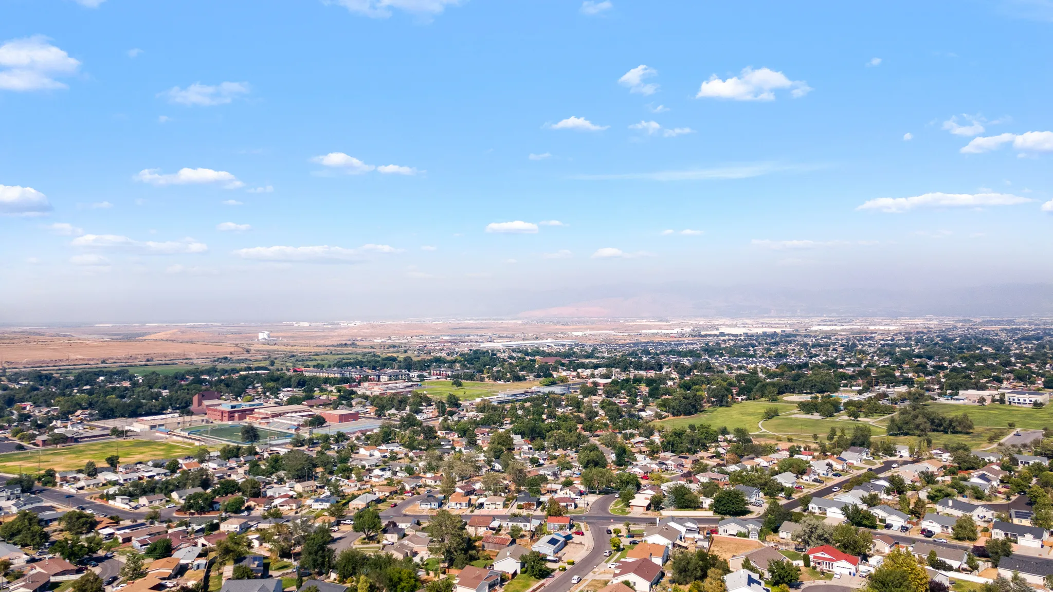 Expansive aerial perspective showcasing a residential area with varied housing styles
