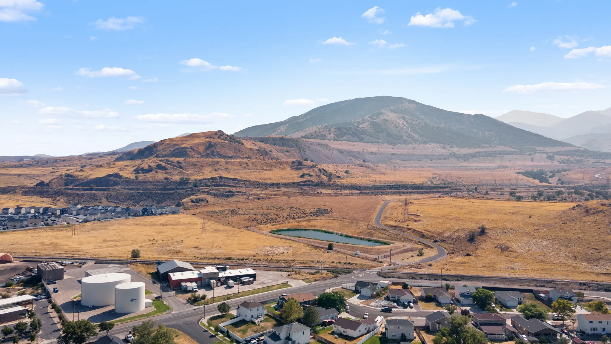 Expansive mountain backdrop with a prominent body of water