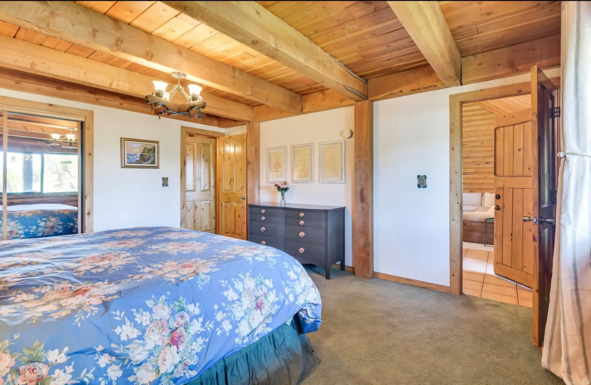 Exposed natural wood beam ceiling and wall accents