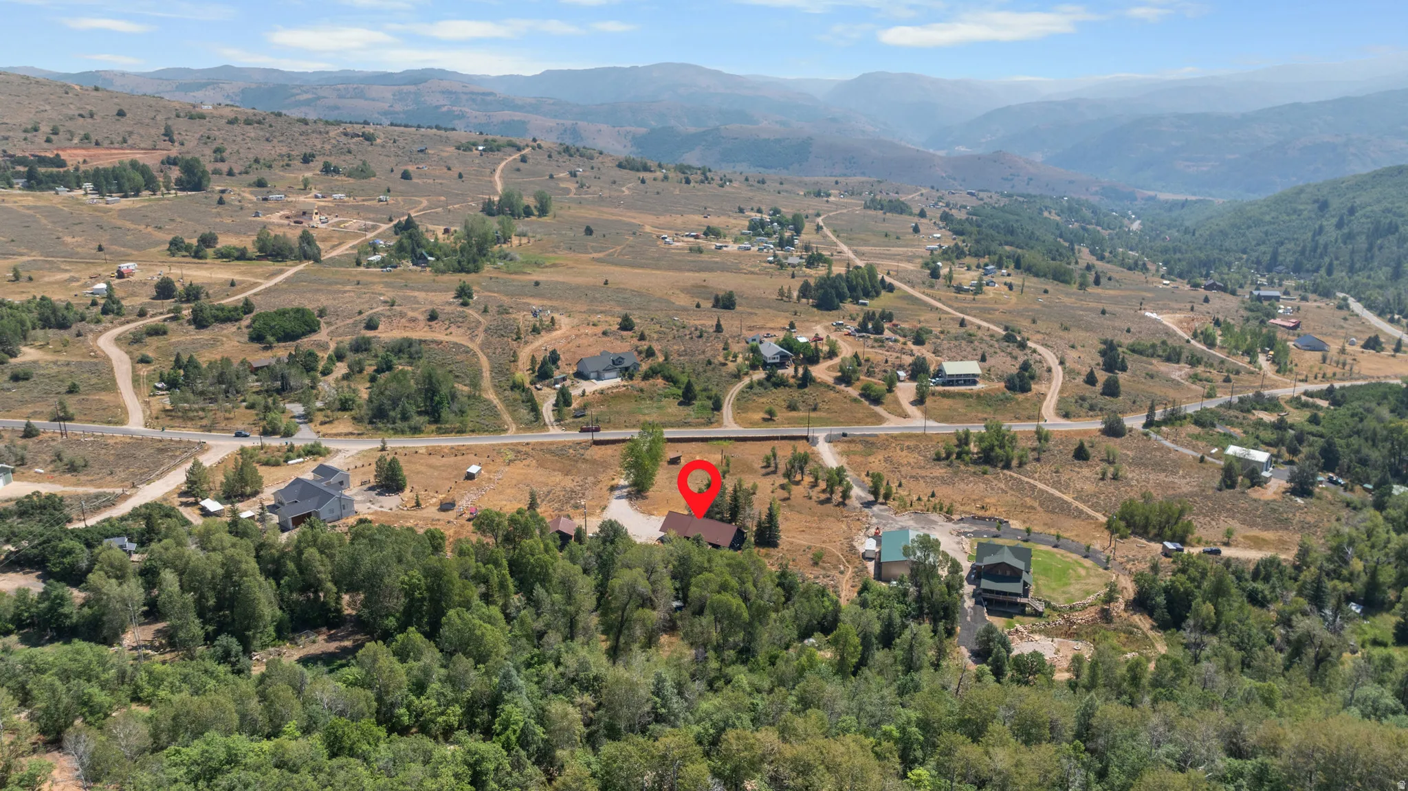 Mountainous terrain with scattered residences