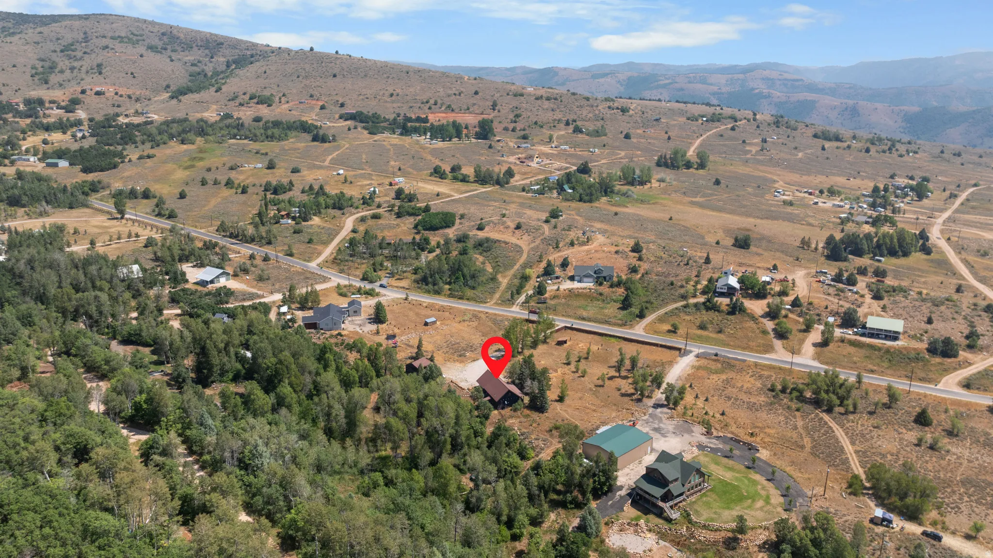 Aerial perspective showcasing expansive natural surroundings and distant mountain ranges