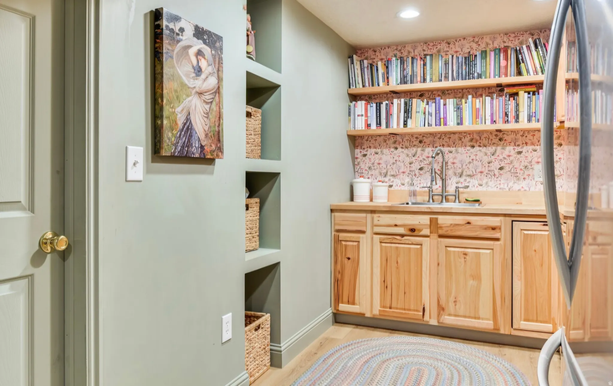 Light wood-finish cabinetry with a built-in sink and wood-finish countertop