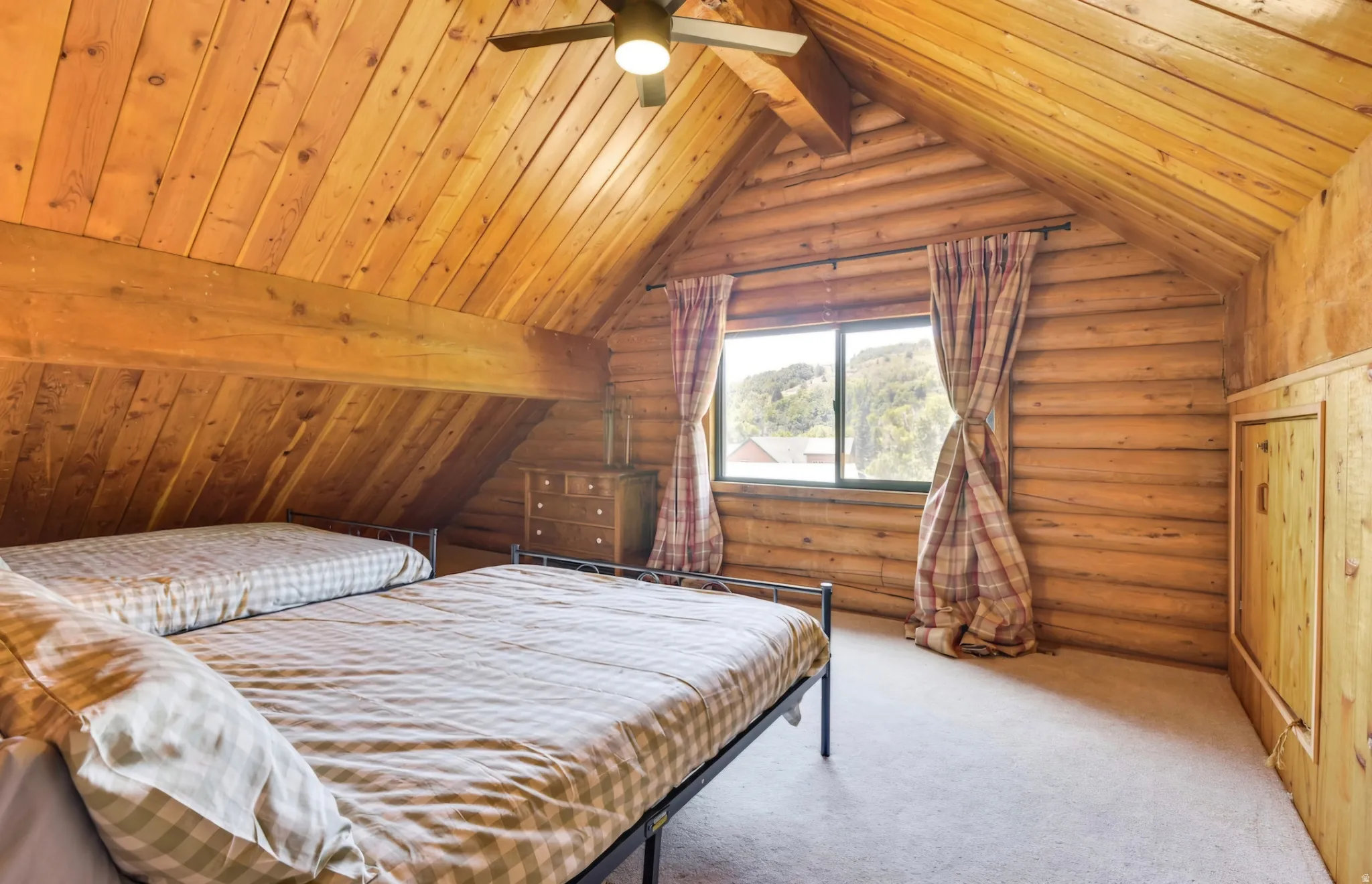 Vaulted wood-paneled ceilings with exposed beams