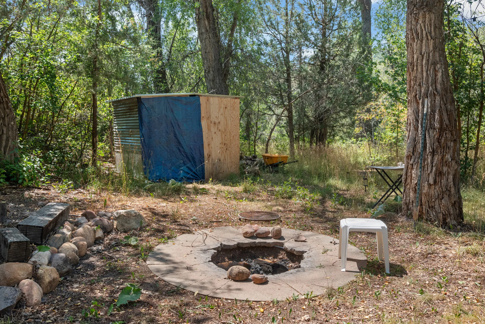 Wooded Retreat with Established Campfire Area and Rustic Outbuilding