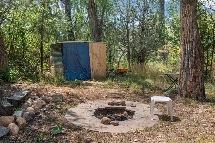 Wooded Retreat with Established Campfire Area and Rustic Outbuilding