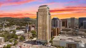 Downtown high-rise featuring a striking Art Deco facade with distinctive setback architecture and illuminated crown detailing