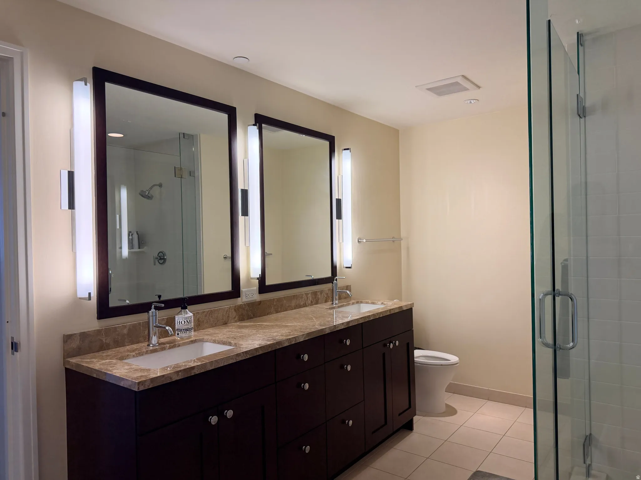 Dual vanity with stone countertop and undermount sinks
