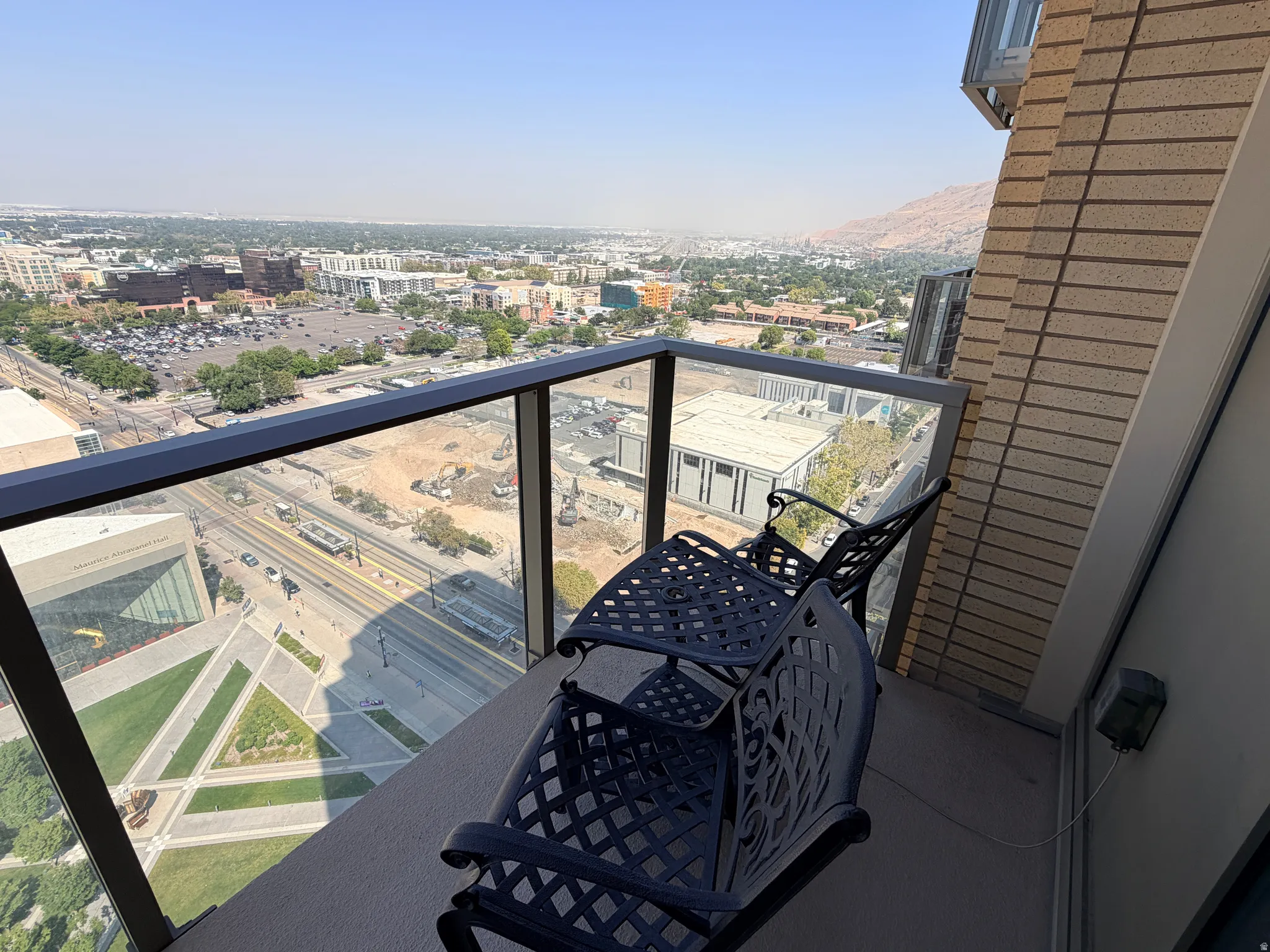 Private balcony with a glass and metal railing