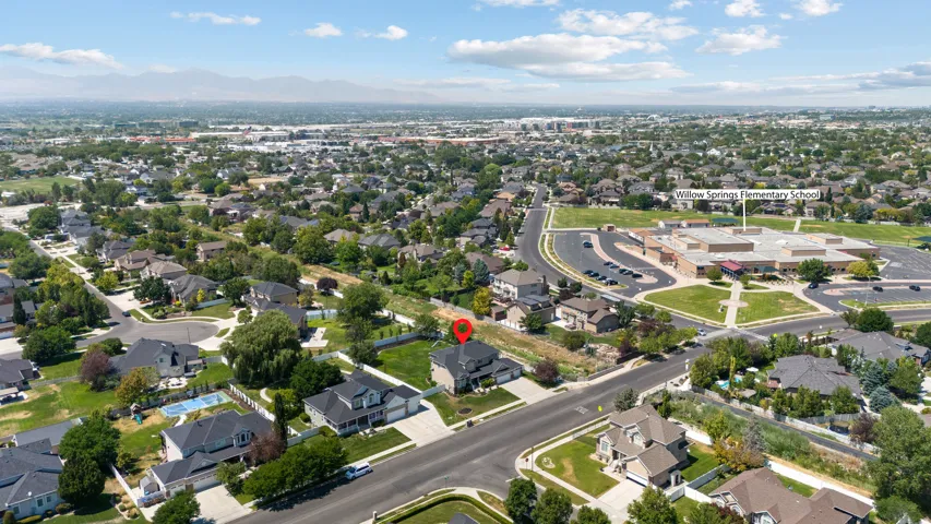 Aerial overview of a residential neighborhood with elementary school nearby