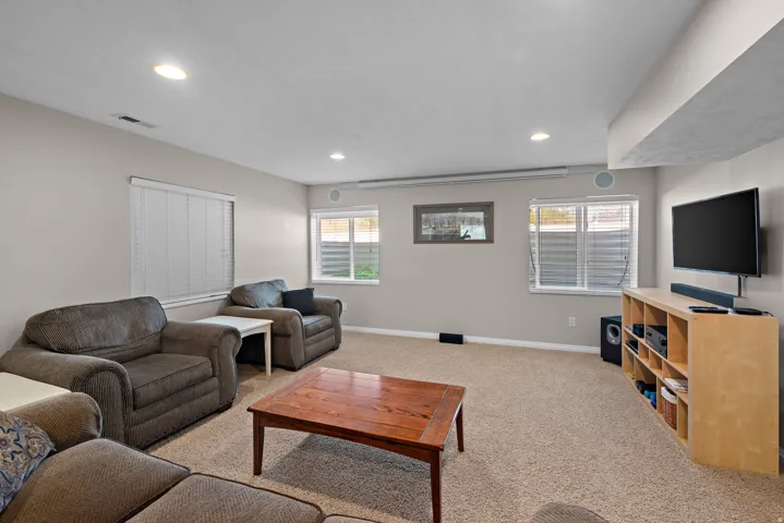 Theater area, including projector, retractable projection screen and black out shades