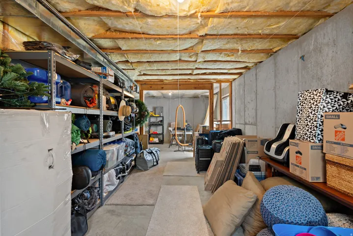 Unfinished basement area that could easily be finished into two bedrooms