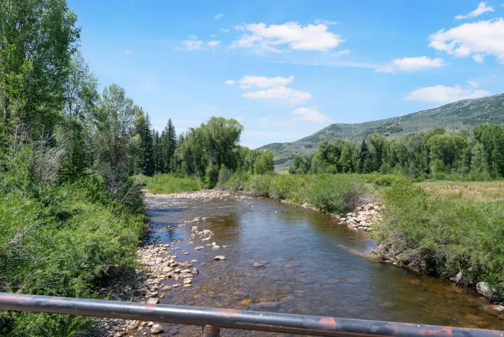 Natural river setting with a rocky bed and clear water
