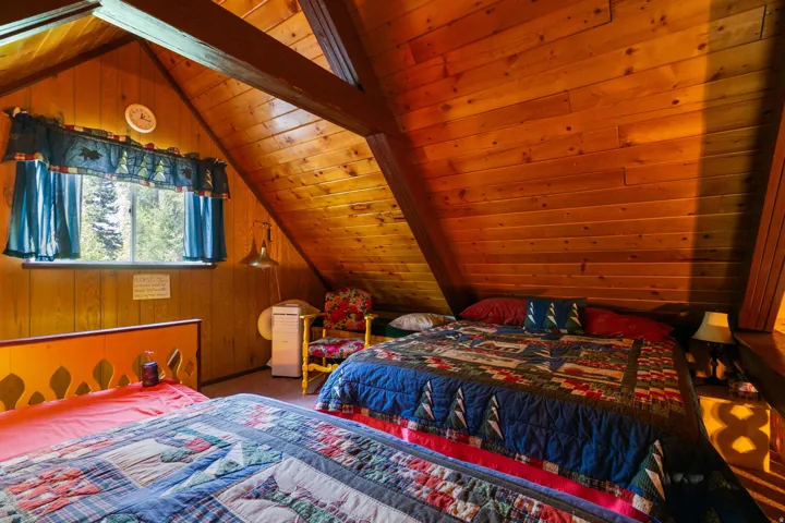 Vaulted wood-paneled ceiling with exposed beams