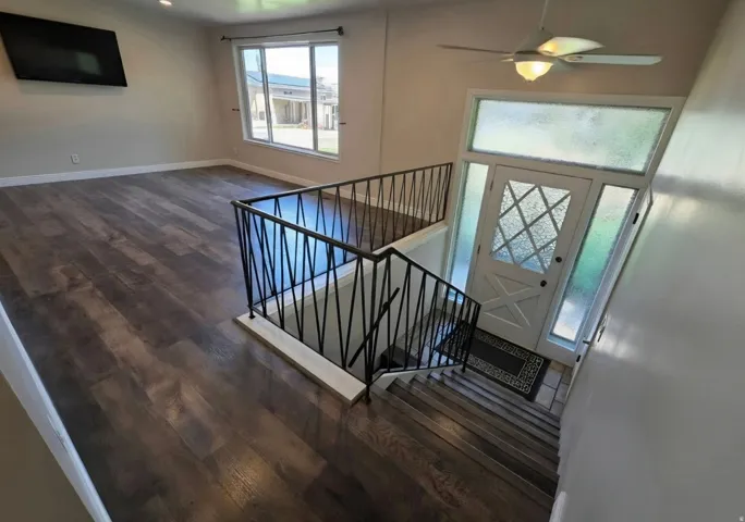 Entryway featuring a white door with decorative glass, transom window, and side lights