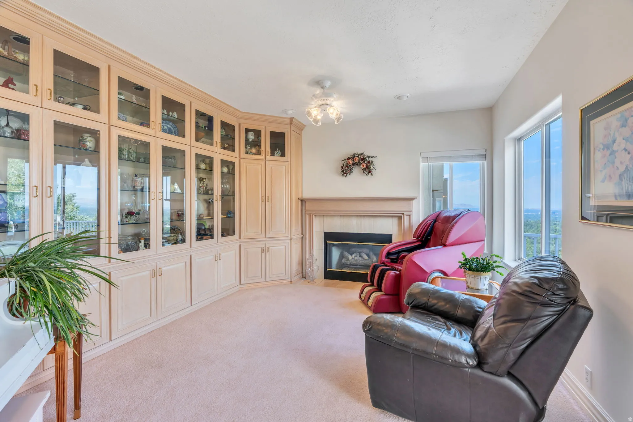 Built-in cabinetry with glass-front display storage and lower solid panel doors