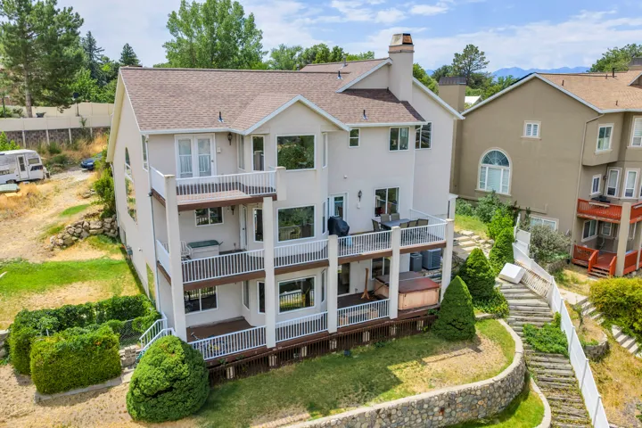 Multi-level stucco exterior with tiered balconies