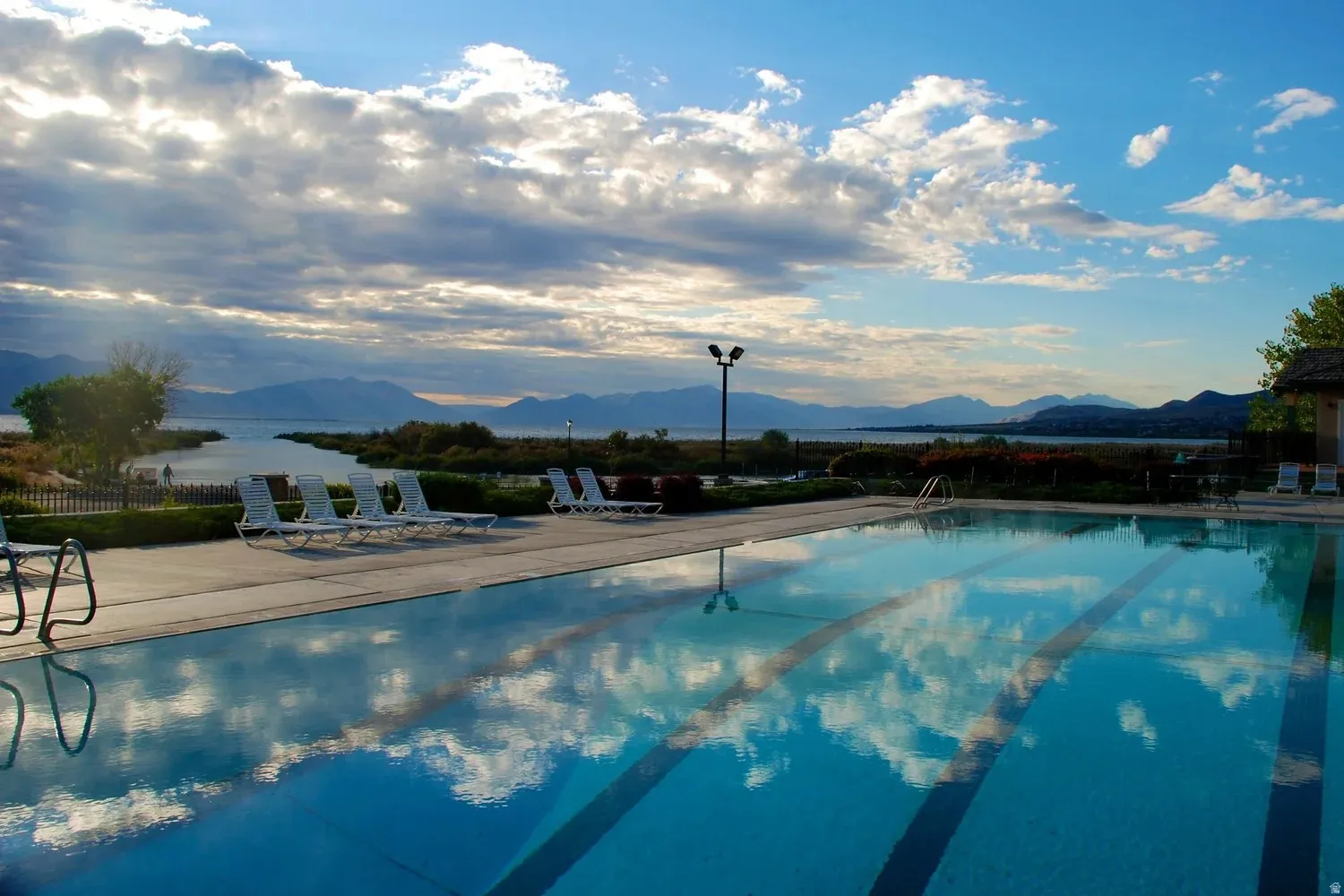 Outdoor swimming pool with integrated lane lines and a concrete surround