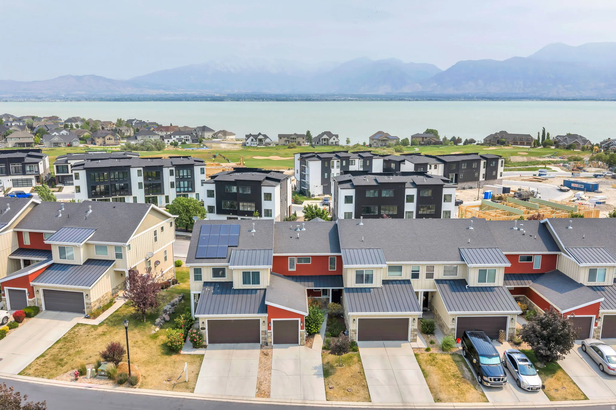 Townhome community featuring a mountain and water backdrop