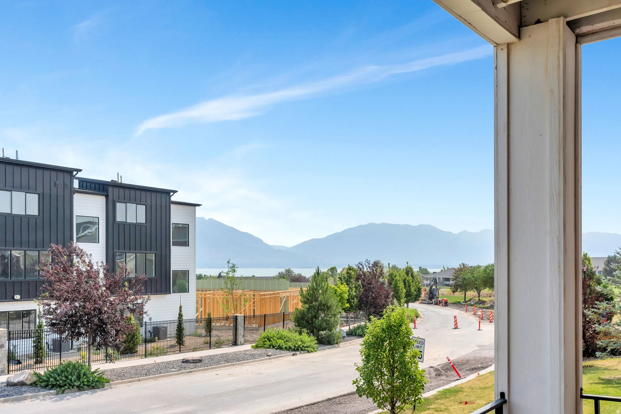 Balcony overlooking distant mountains and a body of water