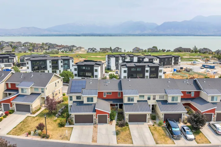 Townhome community featuring a mountain and water backdrop