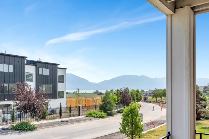 Balcony overlooking distant mountains and a body of water