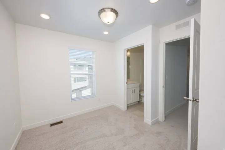 Carpeted room with recessed lighting and a flush mount ceiling fixture
