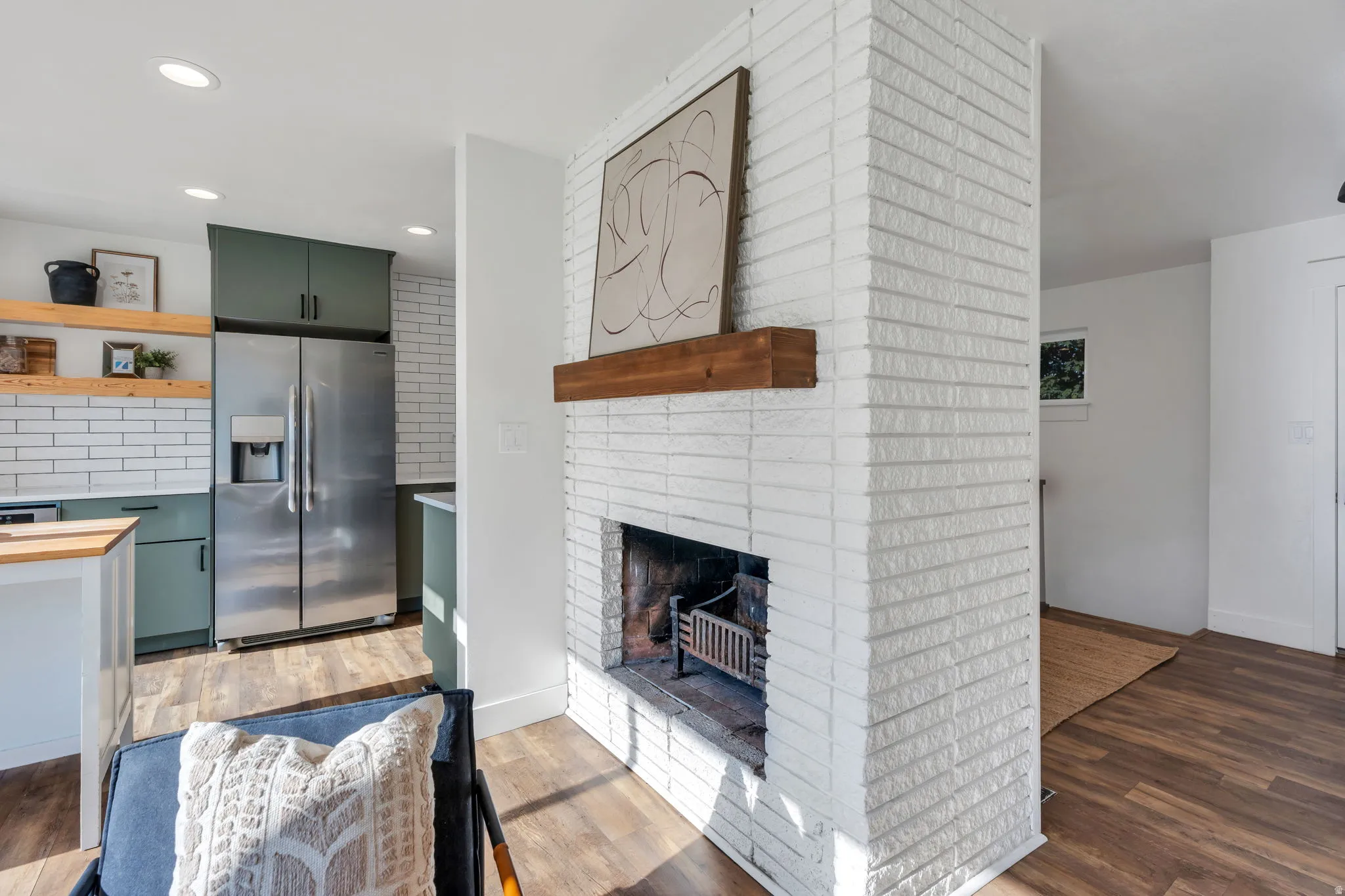 Corner fireplace with a wood mantel