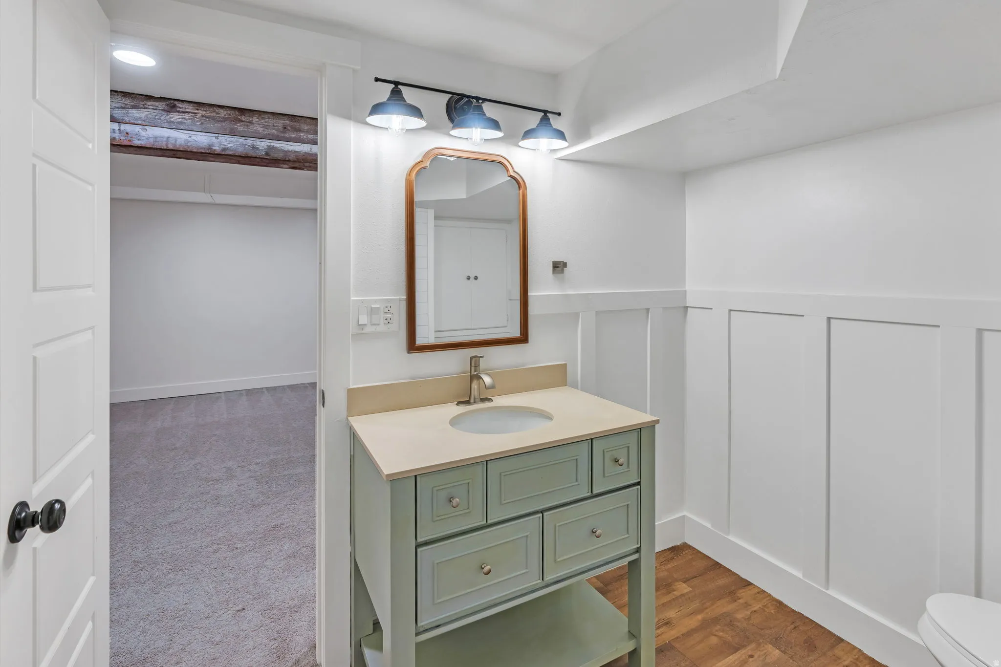 Basement bathroom has a custom vanity