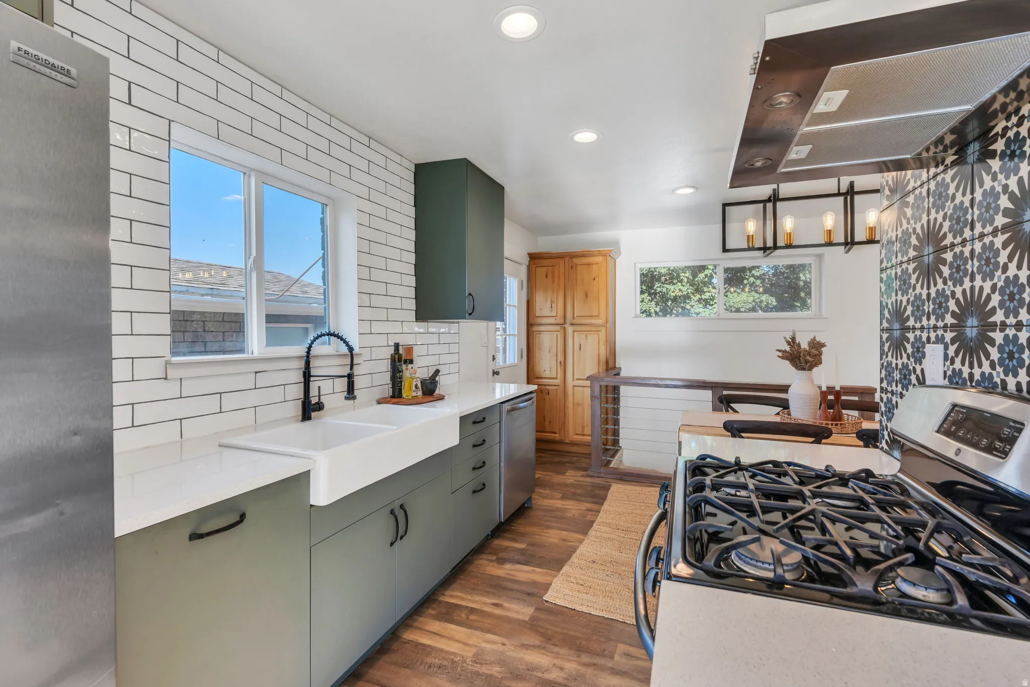 Kitchen featuring wood-finish flooring