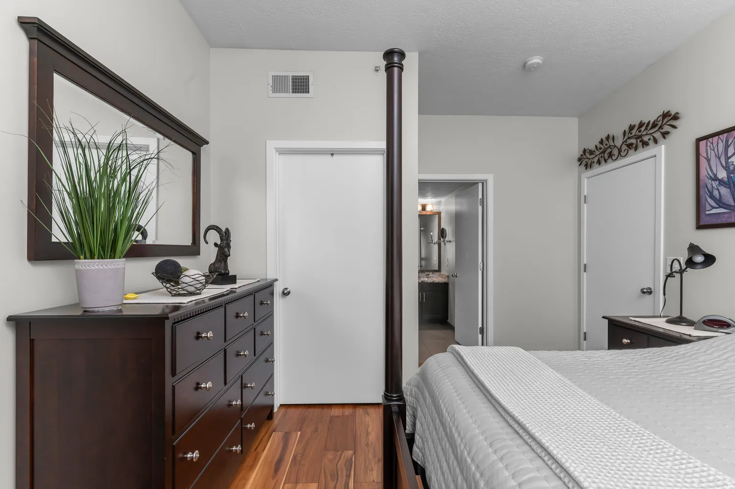 Interior room featuring wood-finish flooring, light neutral wall tones, and recessed ceiling lighting