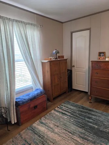 Primary Bedroom featuring wood-finish flooring, view 2.