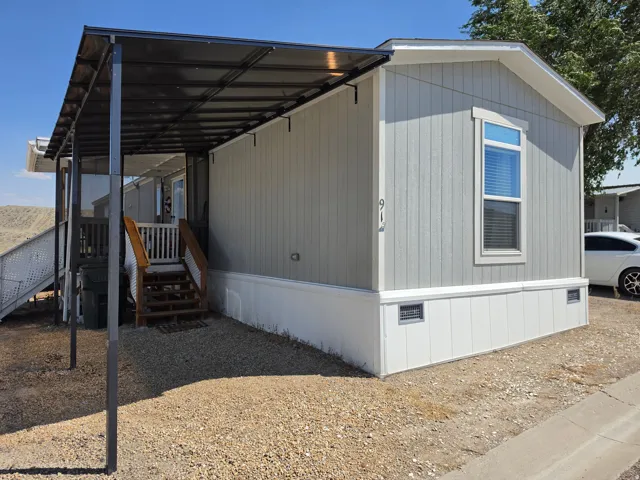 Light gray siding exterior with white trim details