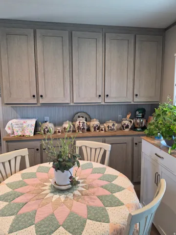 Kitchen featuring wood-finish cabinetry.