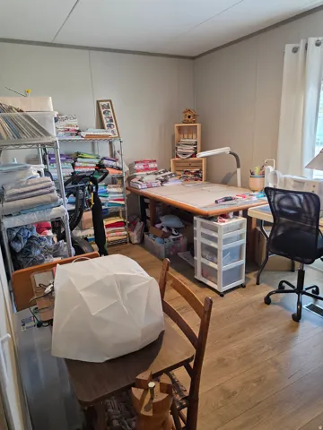 Bedroom 2, currently used as a crafting room.