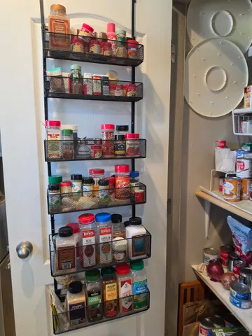 Pantry with storage on back of the door.