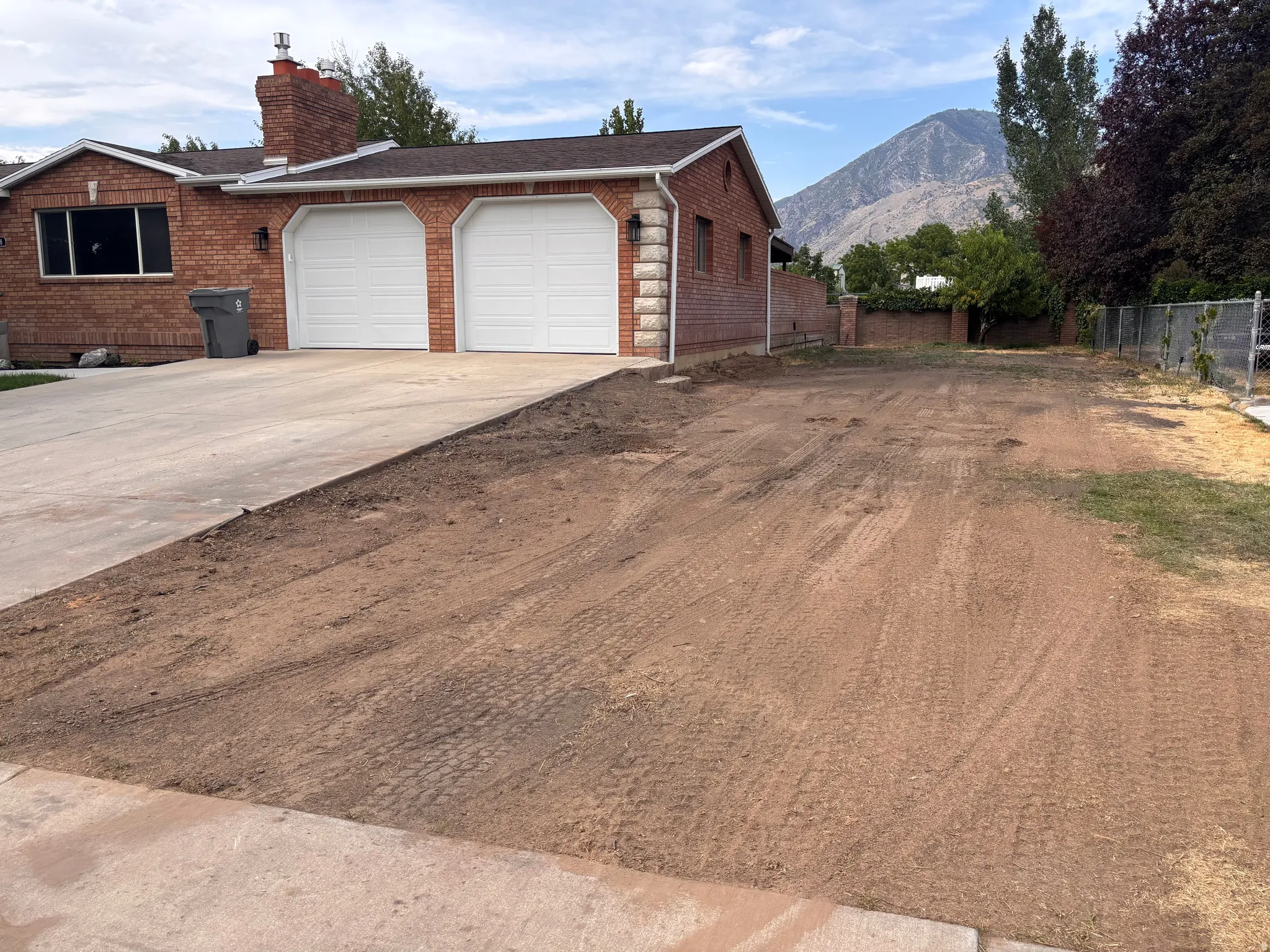 Brick ranch-style residence featuring a two-car extra-deep garage, huge driveway, and extra space for RV parking