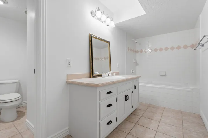 Full bathroom featuring a private water closet